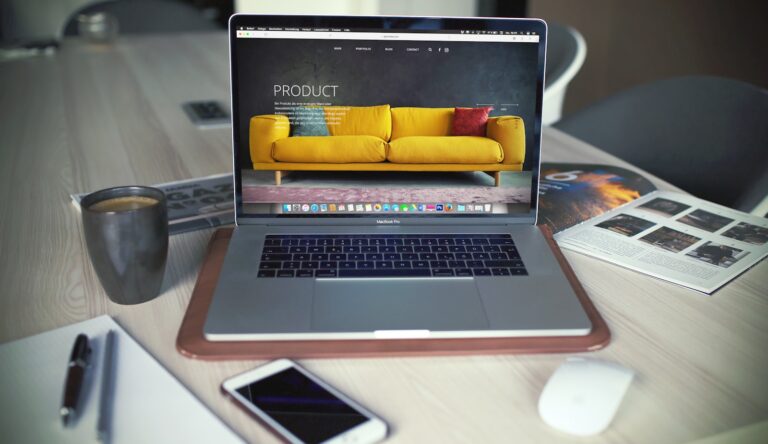 Open laptop beside a mug on a desk, representing letting Claude manage your WordPress website