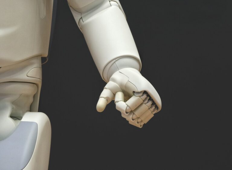 White humanoid robot hand, representing AI agents connected to WooCommerce