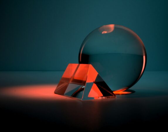 Clear glass ball on a box, representing managing WordPress plugins with AI