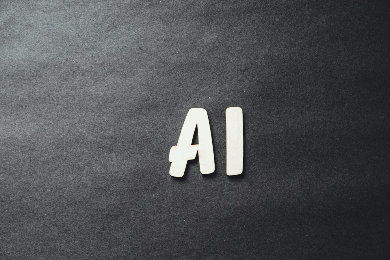 The letters AI in white on a dark background, representing connecting Claude to WordPress using MCP